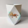 origami-windlicht-krabbe-kollektion-meeresbrise Sand-Türkises Origami-Windlicht zum Basteln mit maritimem Krabben-Motiv, Kollektion Meeresbrise.
